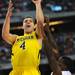 Michigan freshman Mitch McGary looks for a basket over Florida junior Casey Prather in the second half at Cowboys Stadium on Sunday, March 31, 2013. Melanie Maxwell I AnnArbor.com